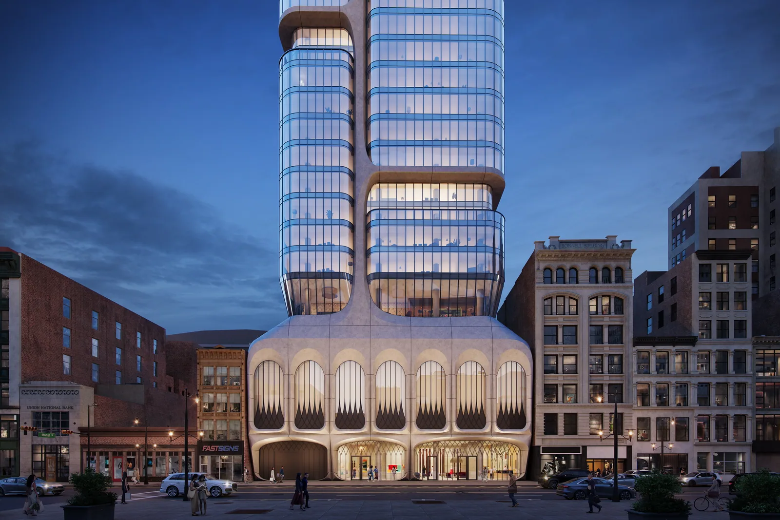 Sculpted arched base of Summit Tower at 206 Market St among historic Newark facades at dusk