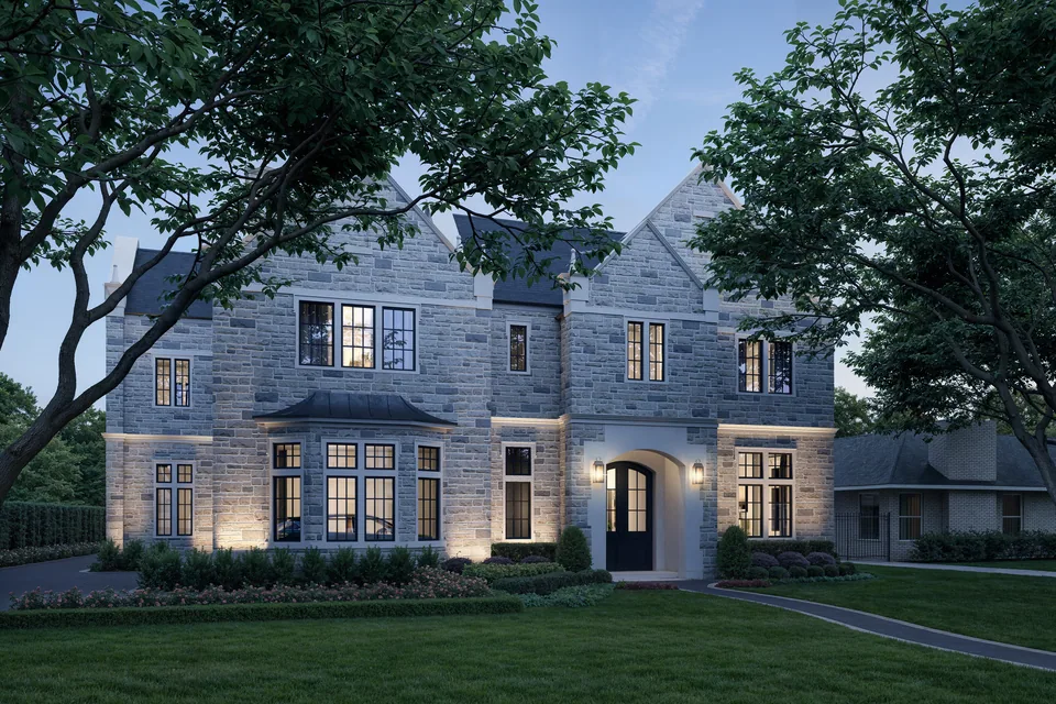 5554 Longmont manor house in Houston at dusk with lit windows, arched entry and front lawn