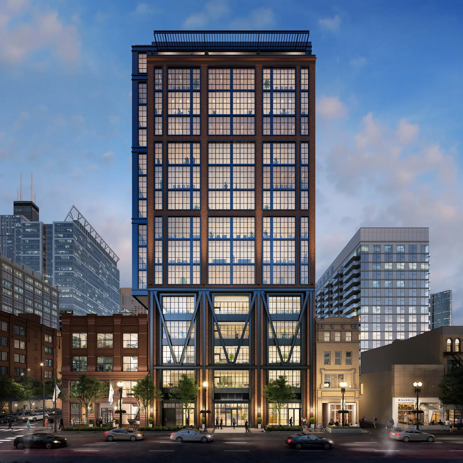 Brick and blue steel office building at 609 West Randolph in Chicago's West Loop at dusk