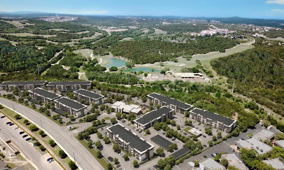 Aerial of the Chase Hill apartment buildings set into the Hill Country landscape in north San Antonio