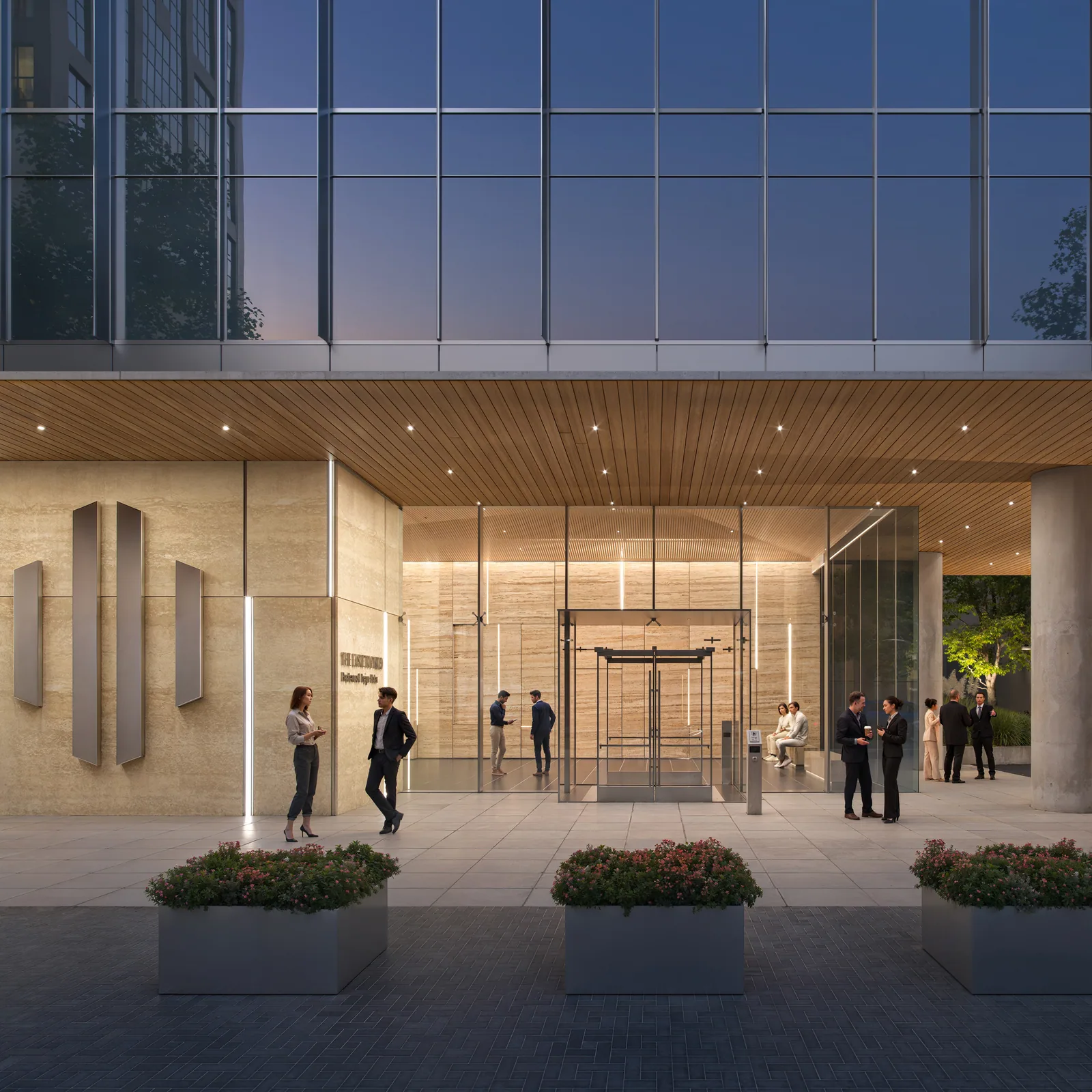 Stone and wood lobby entrance of the 121 Fayetteville office tower in Raleigh in the evening