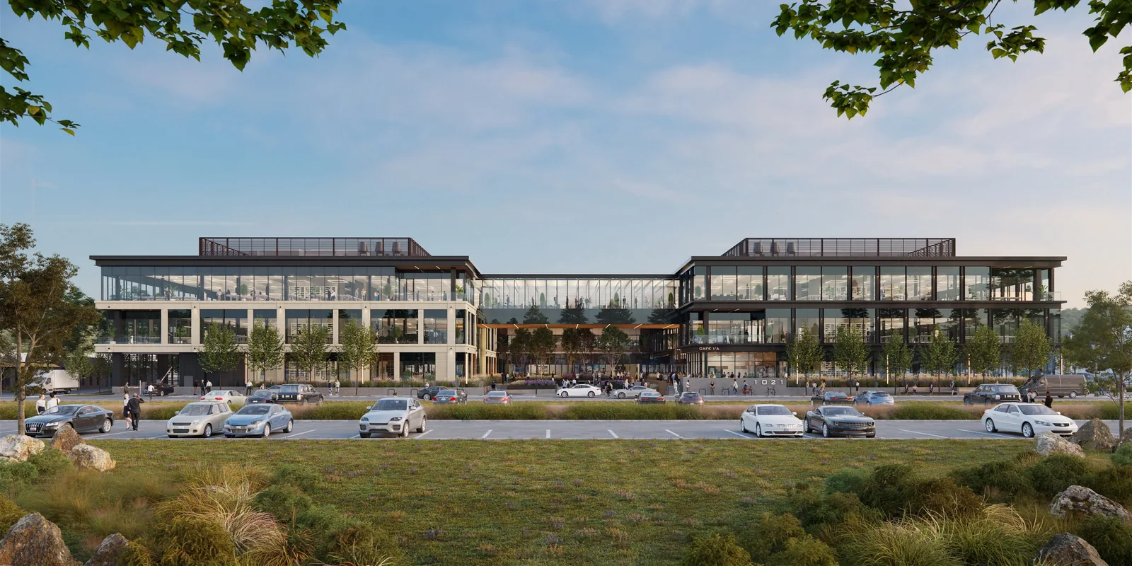 Long view of the 1021 Howard Avenue life science campus in San Carlos across a meadow