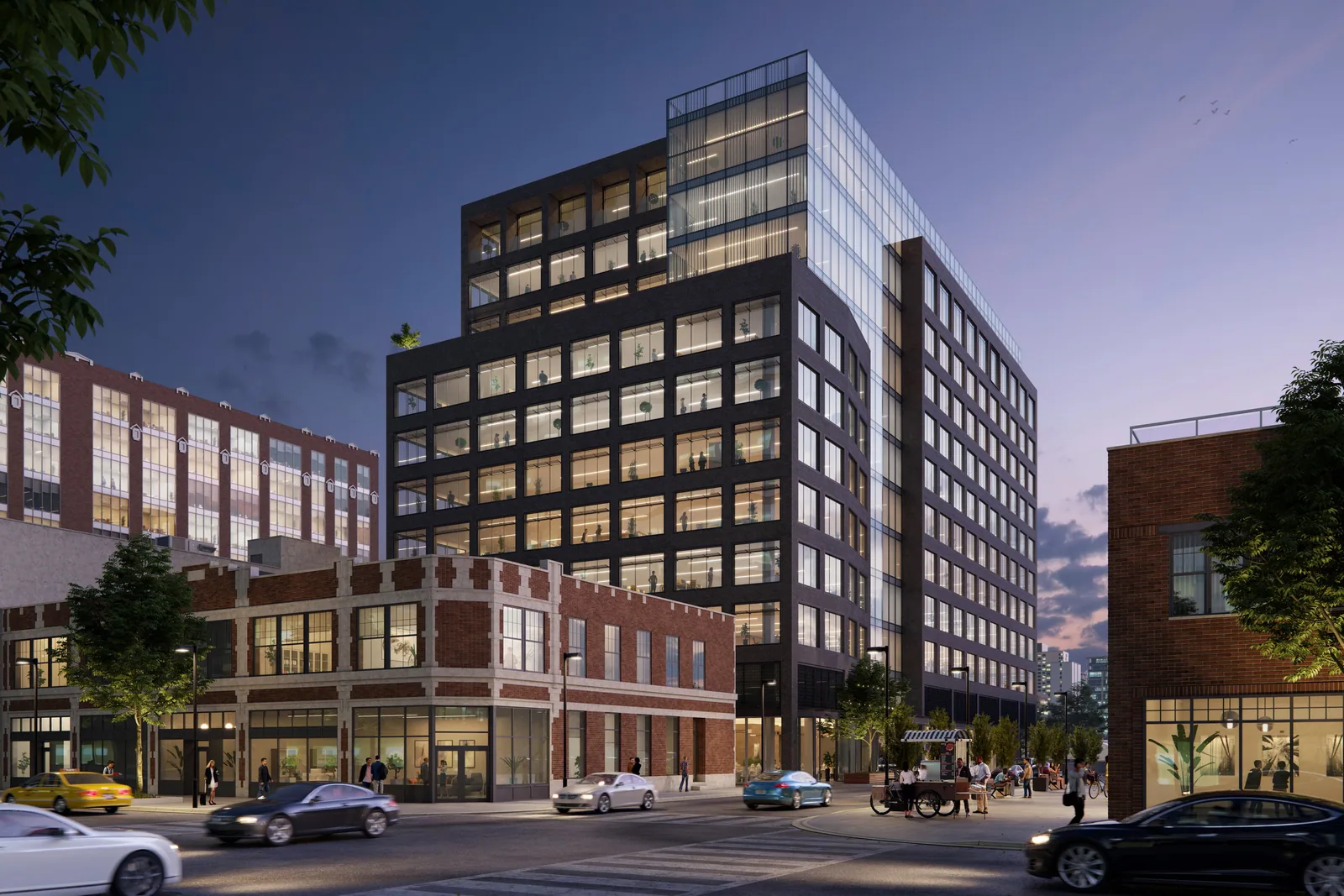 Dark brick and glass office building at 310 N. Sangamon in Chicago's West Loop at dusk