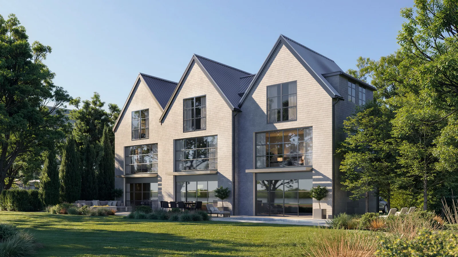 Three-gabled shingle custom home at 3366 Harness Creek in Annapolis seen from the garden