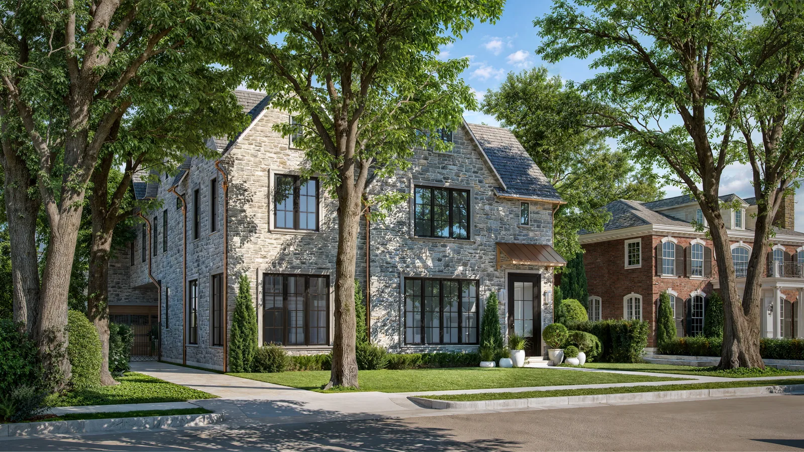 Stone custom home at 3662 Overbrook Lane in Houston with steep roofs and black windows under oaks