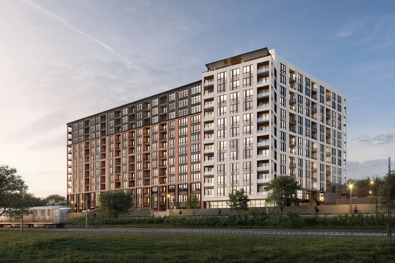 Madison West Elm in Conshohocken seen across a meadow with the rail line in front