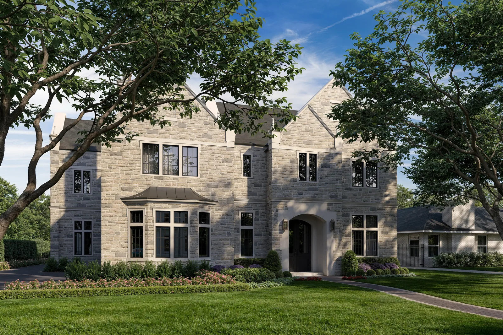 Limestone English manor house at 5554 Longmont in Houston's Tanglewood with gables and bay window