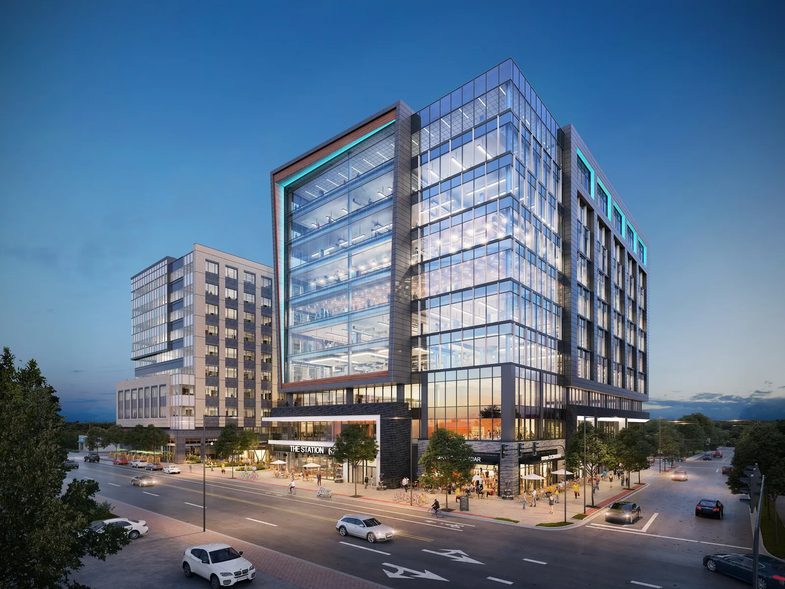 Glass office building at 623 Hillsborough in Raleigh at dusk on a street corner