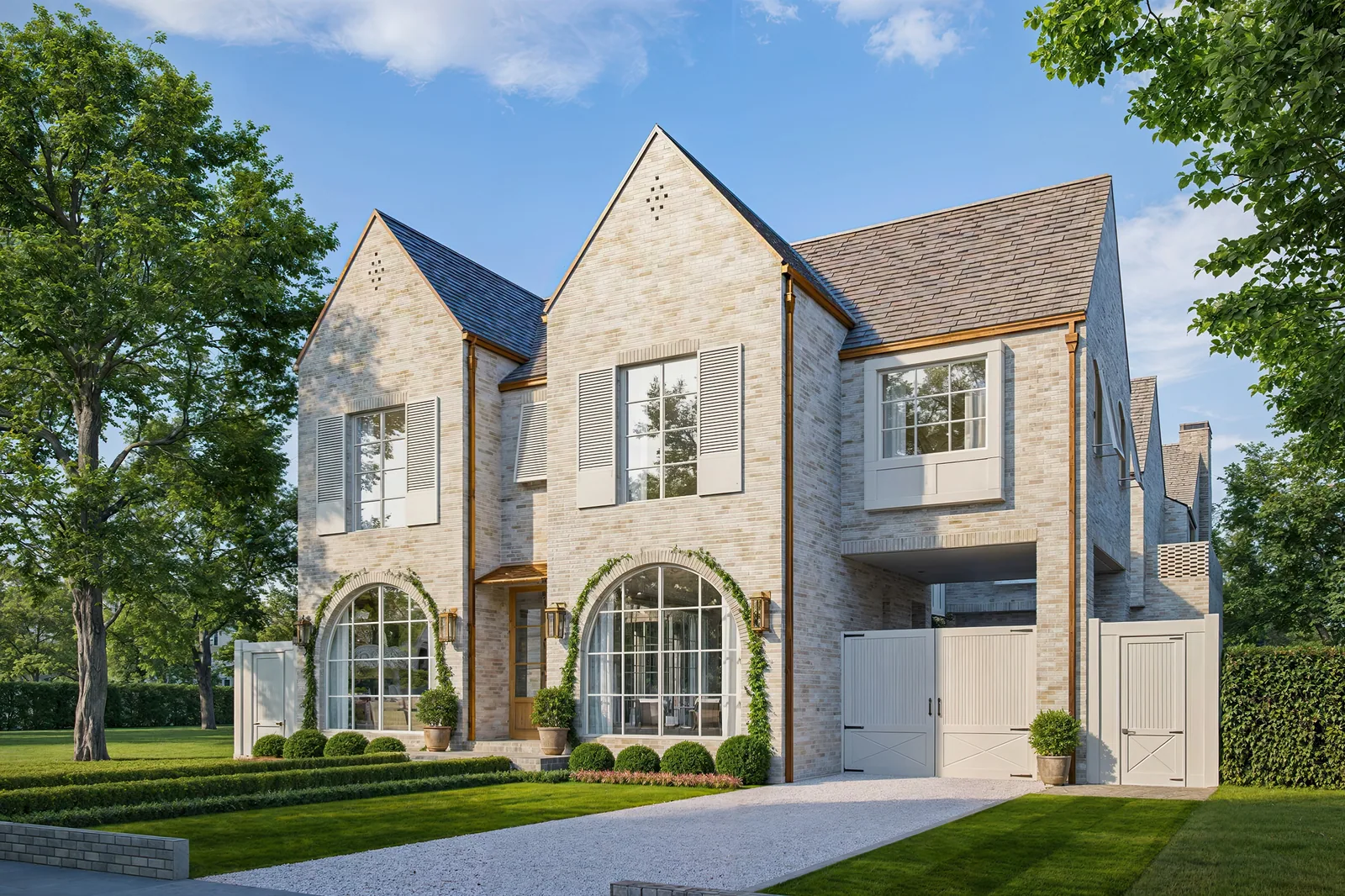 White brick custom home at 6335 Belmont Street in Houston with twin gables and arched windows