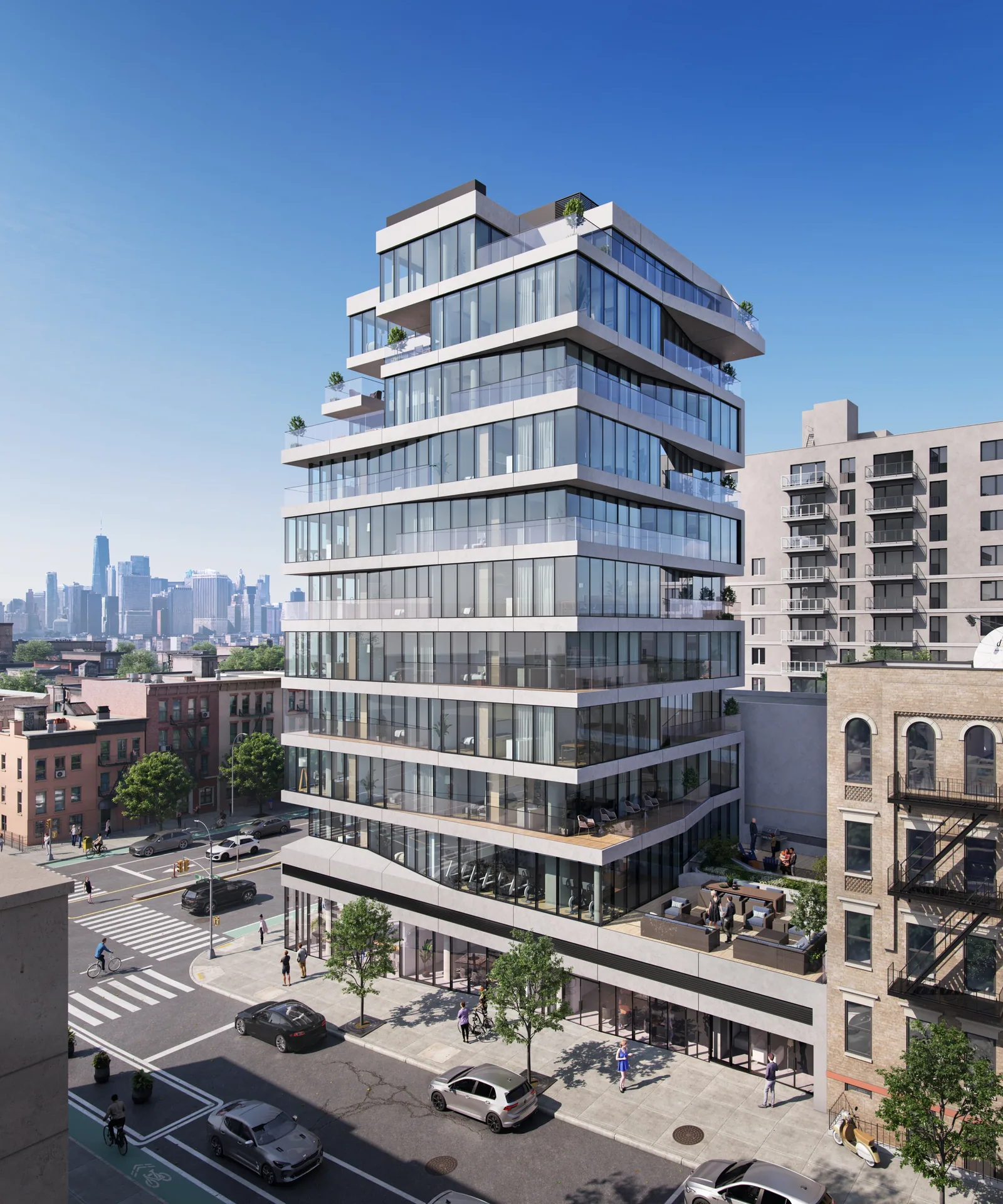651 Fourth Avenue in Brooklyn with offset glass floors and terraces, the Manhattan skyline beyond