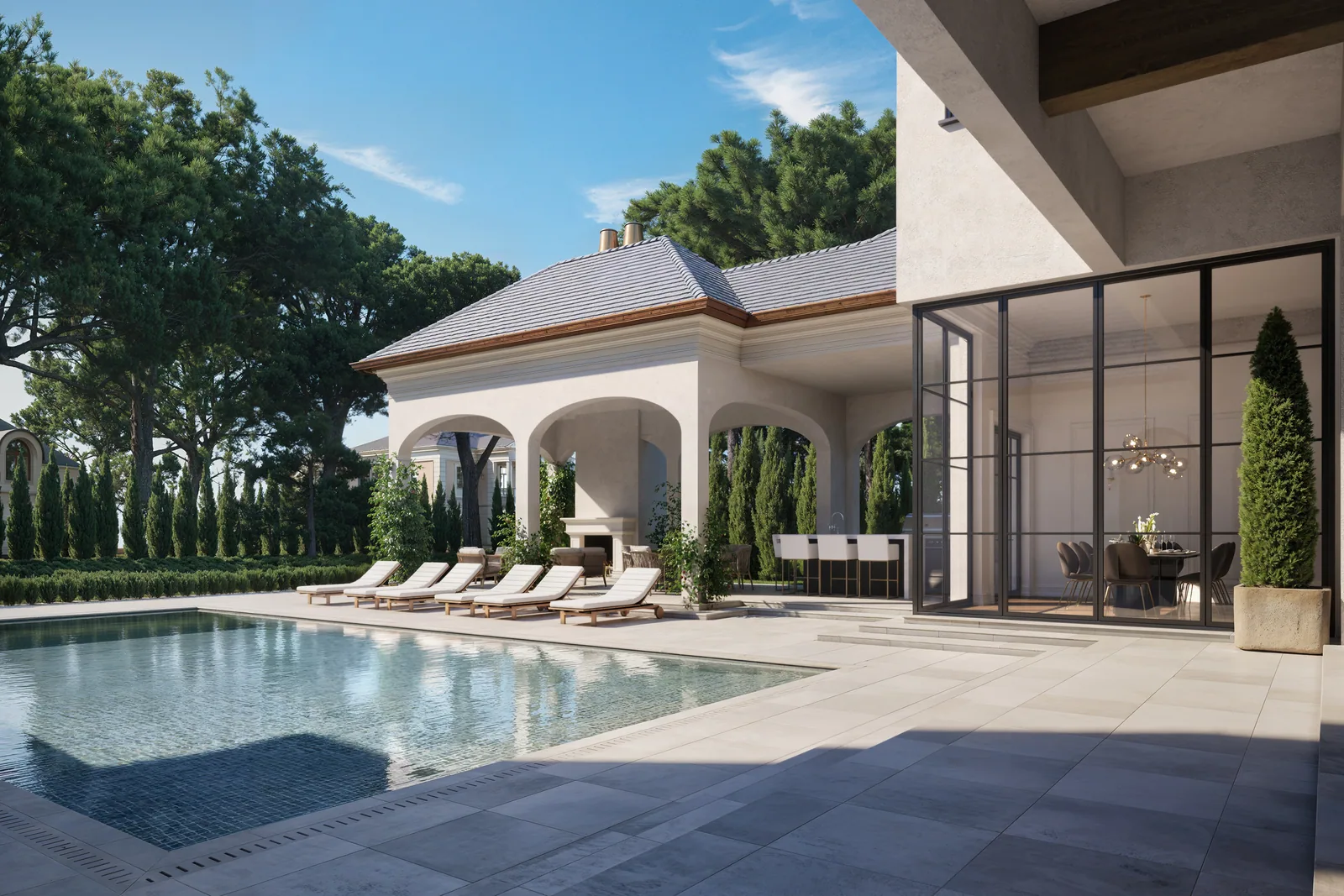 Pool court with arched stone loggia and lounge chairs at the 715 Friar Tuck estate in Houston
