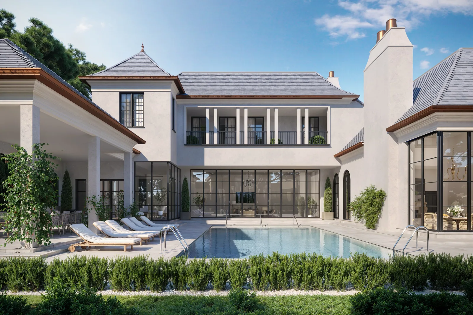 Rear facade, terrace and pool of the 715 Friar Tuck chateau-style home in Houston