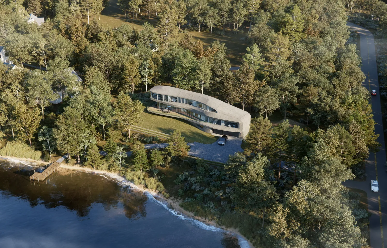 Aerial of the 8 Hawthorne Rd lakeside home in Stockbridge curving along a wooded slope