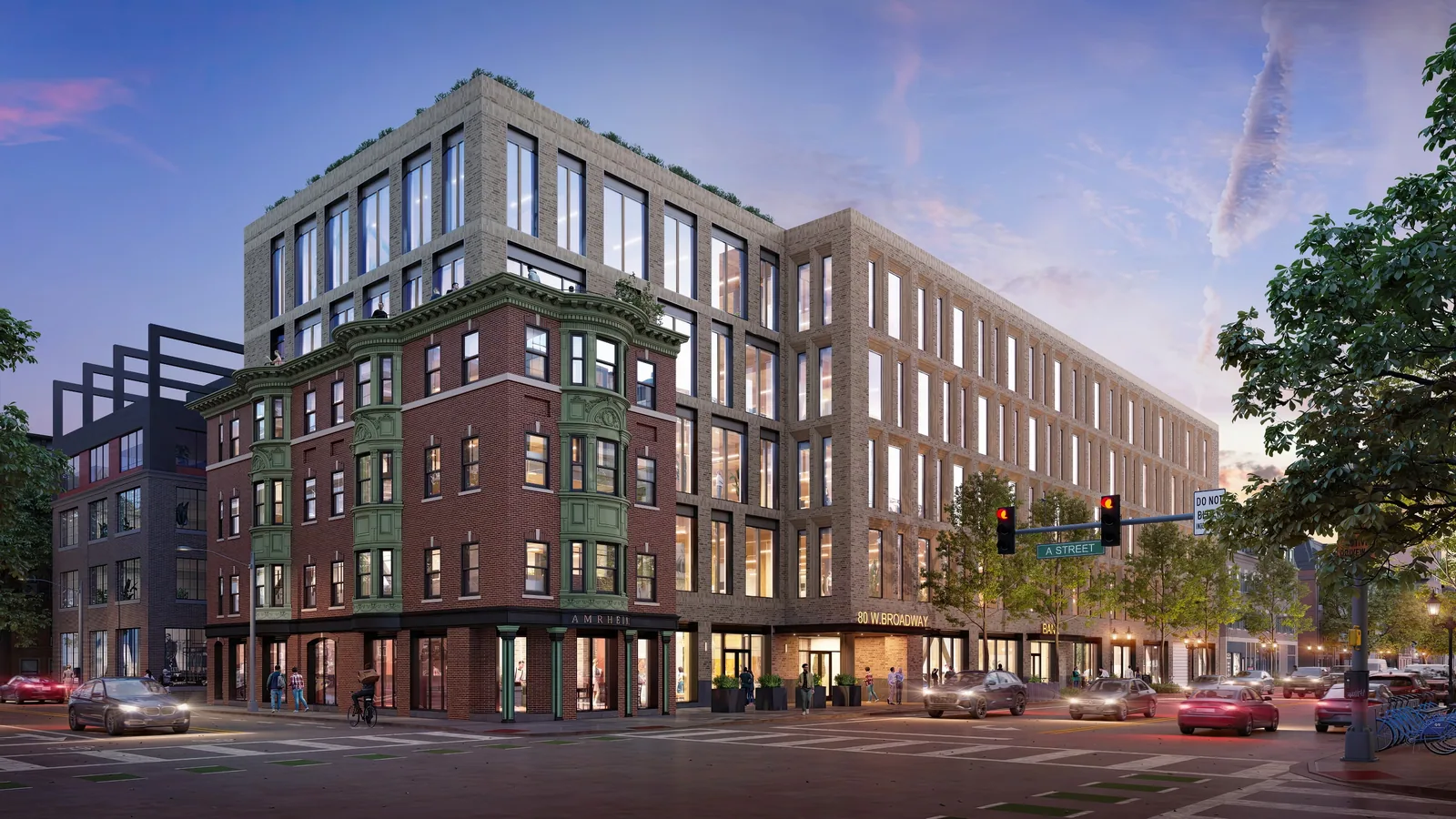 The Beam at 80 West Broadway in South Boston wrapping a historic brick corner building at dusk