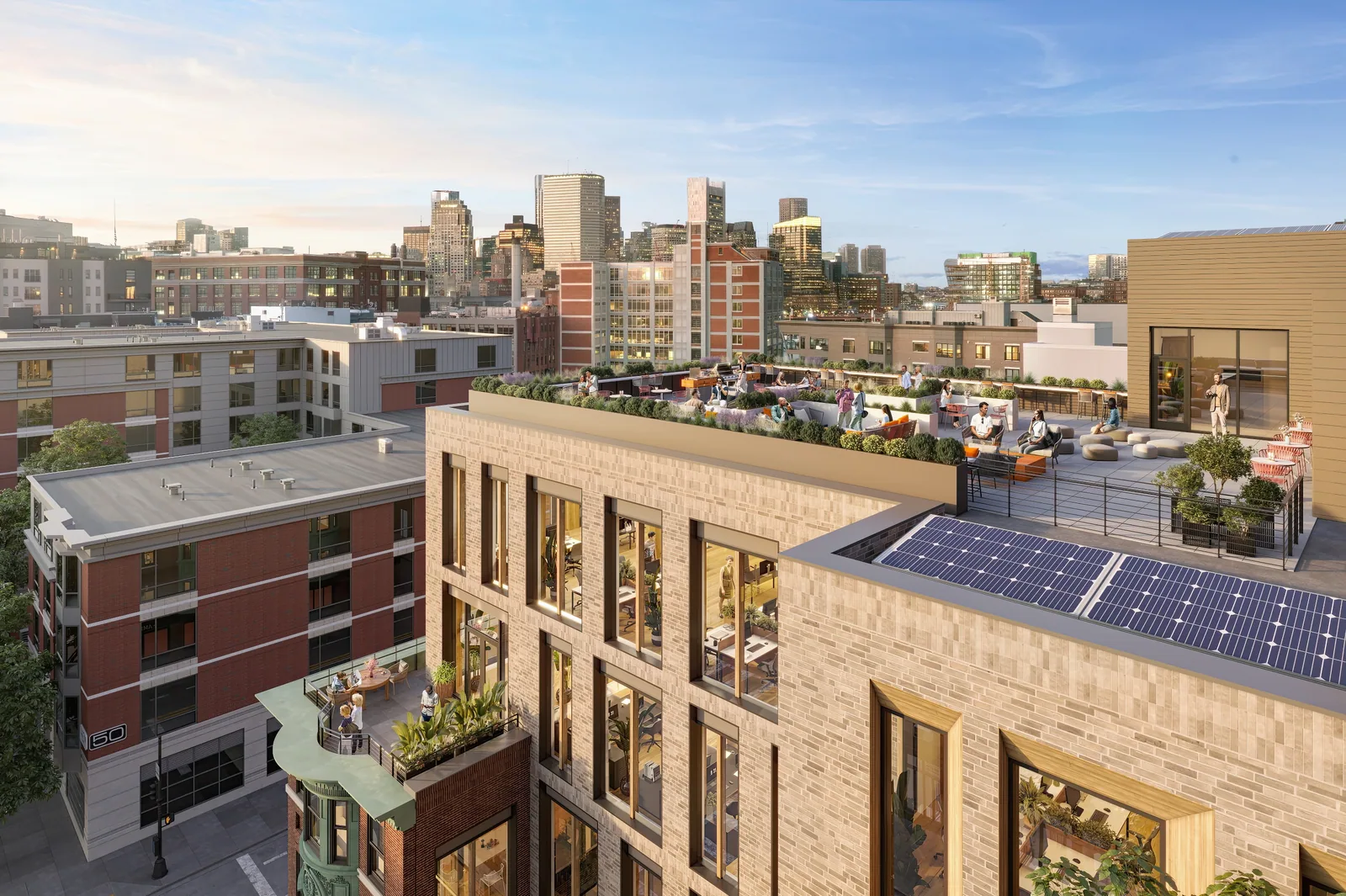 Roof terrace with seating and solar panels at 80 West Broadway, South Boston, with downtown beyond