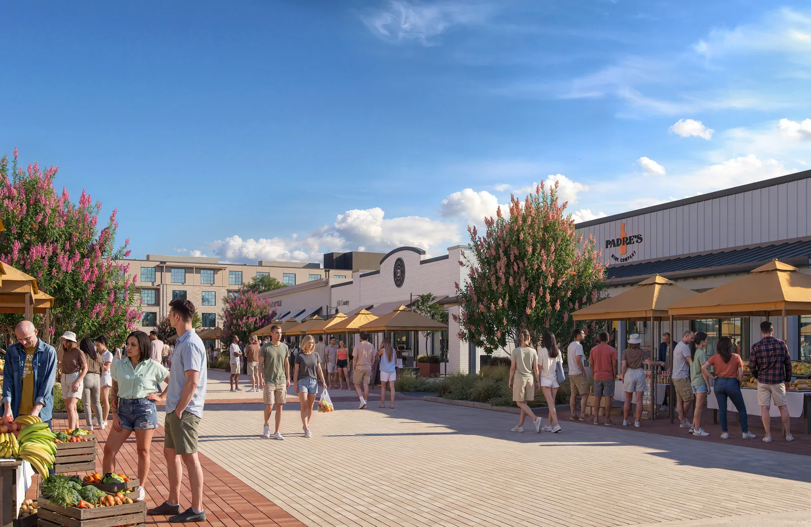 Paved market walk with stalls, flowering trees and crowds at The Meuse, Fredericksburg