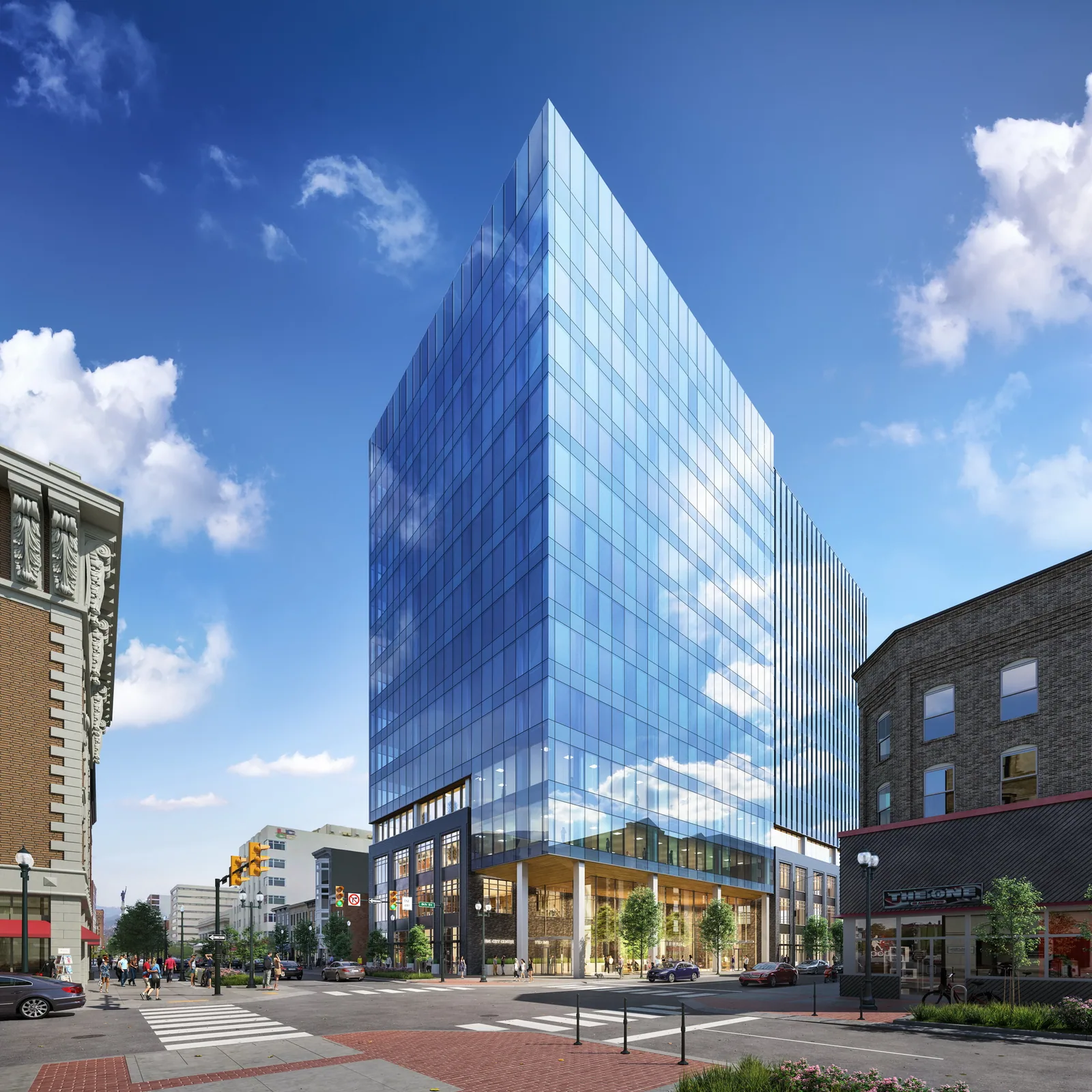 Blue glass office tower with chamfered corner in downtown Five City Center, Pennsylvania, by day