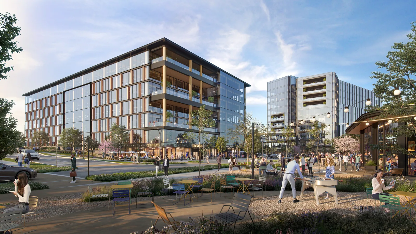 Outdoor commons with seating and people at The Offices at Southstone Yards in Frisco, Texas