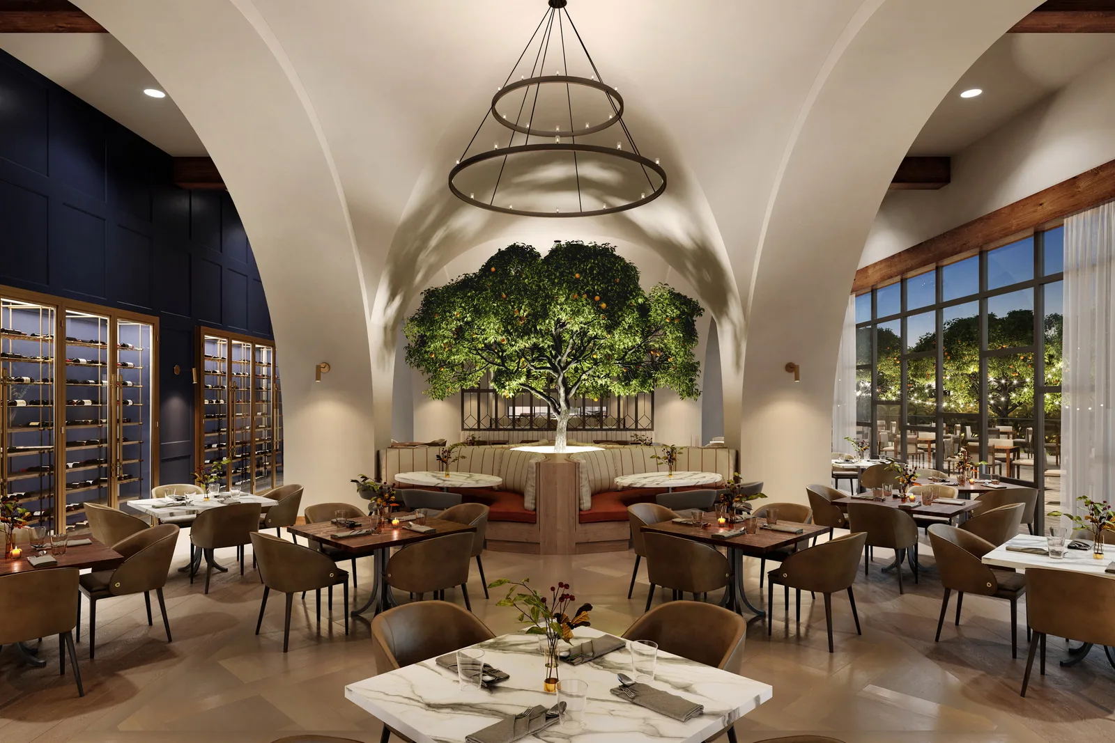 Vaulted restaurant with a tree at its center, wine walls and ring chandelier at Gaylord Pacific
