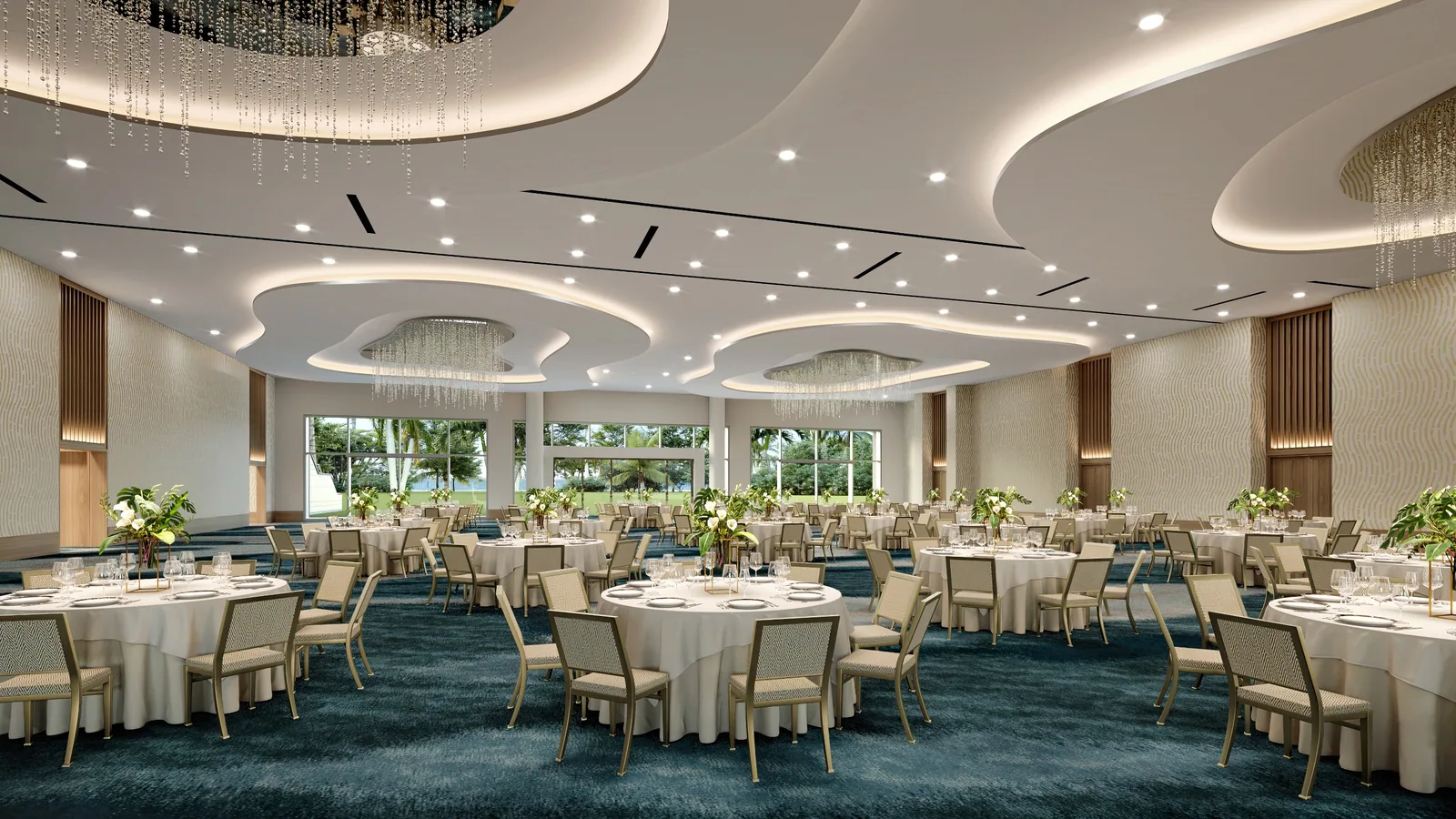 Ballroom set with round tables under a curving lit ceiling and chandeliers at Gaylord Pacific