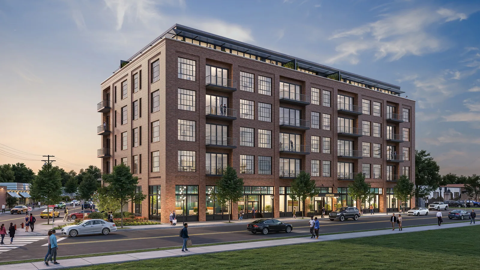 Seven-story red brick apartment building The George in Durham, North Carolina, from the street corner