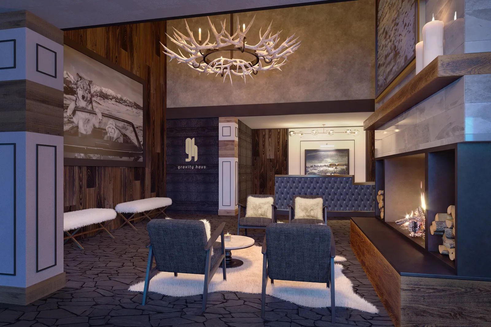Fireside lodge lounge with antler chandelier, reclaimed wood and blue chairs at Gravity Haus