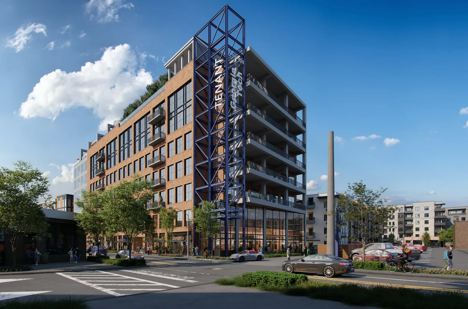 Brick and glass building with a blue steel signage tower at The Interlock in Atlanta's West Midtown