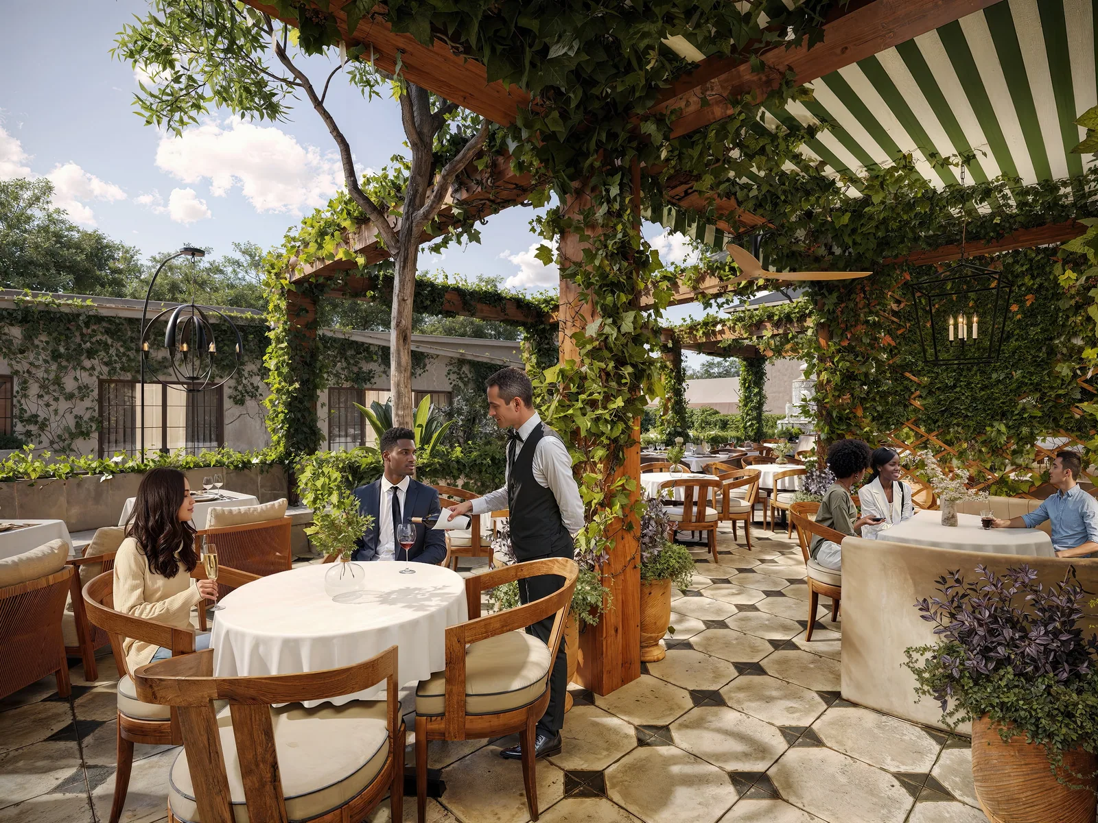 Pergola patio with white tablecloths, striped awning and hex tiles at La Griglia in Houston