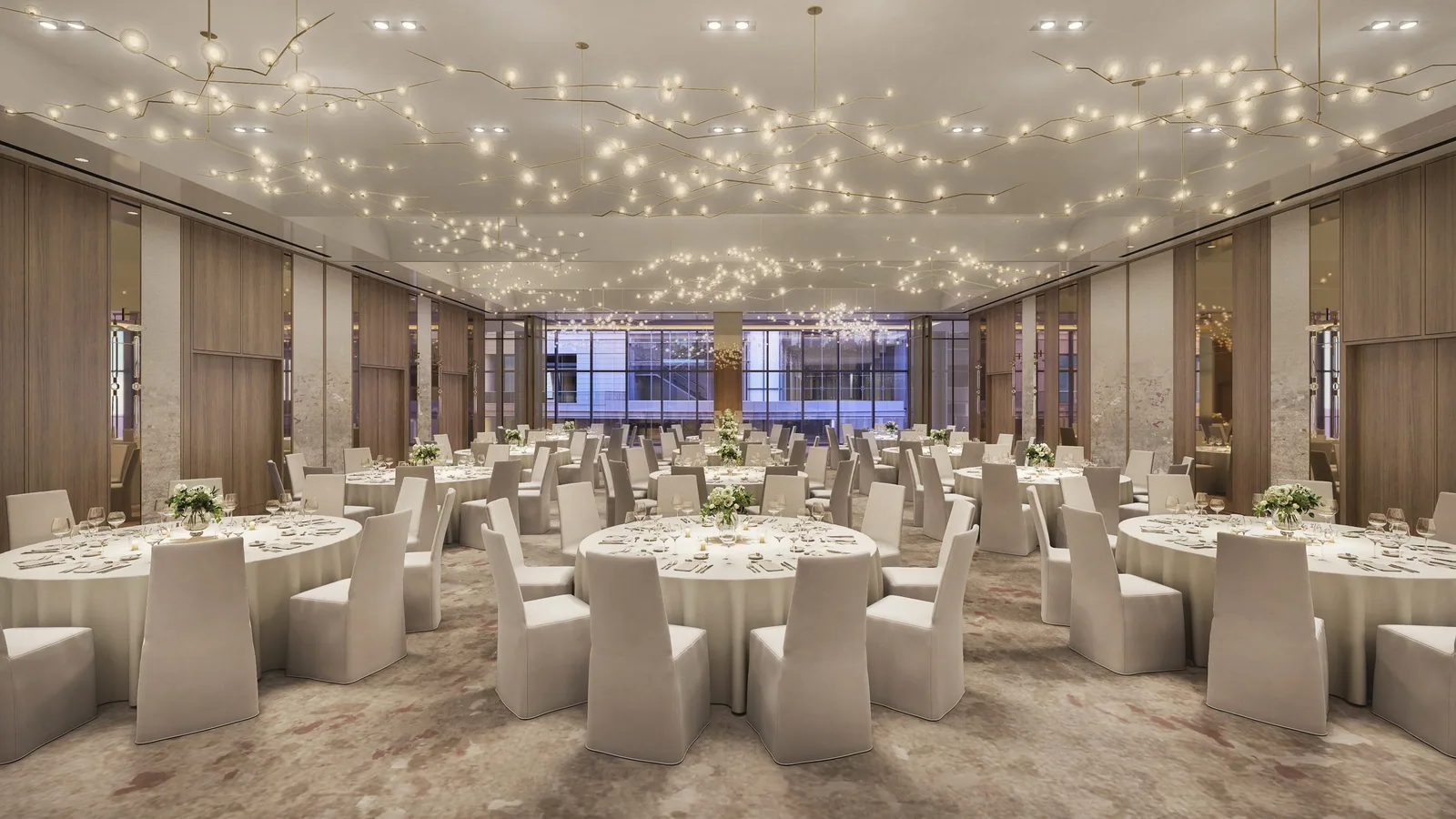 Ballroom with round tables under a ceiling of suspended lights at the Marriott HQ hotel, Bethesda
