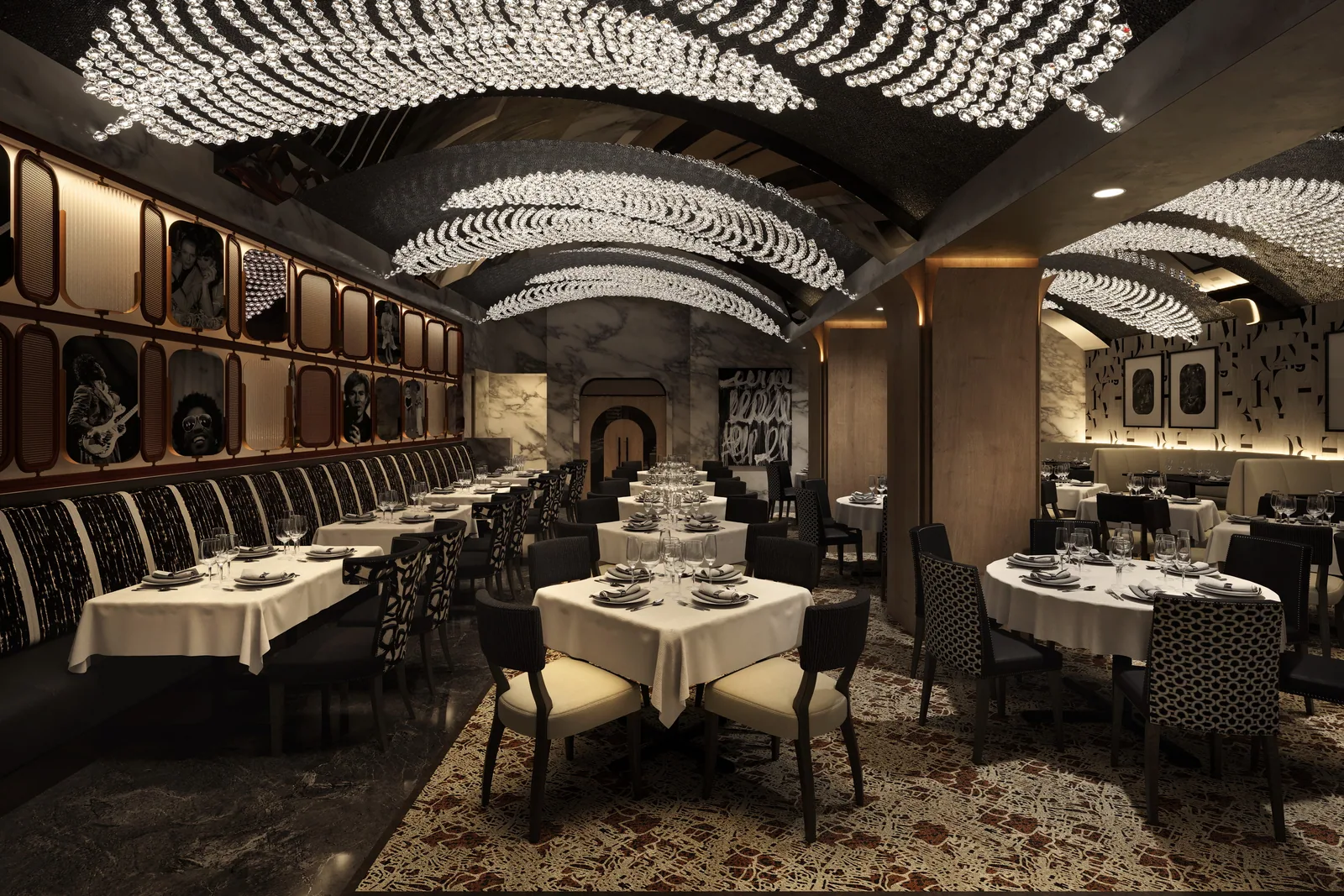 Steakhouse dining room under cascading crystal light fixtures at Mastro's Philadelphia