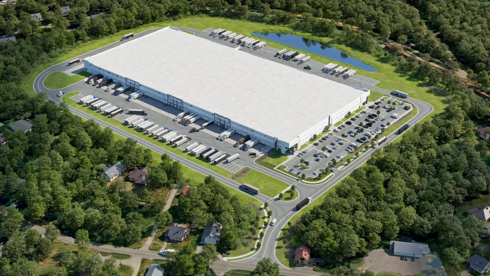 Aerial of The Oaks Commerce Center in Belmont, NC, with truck courts and a stormwater pond among trees