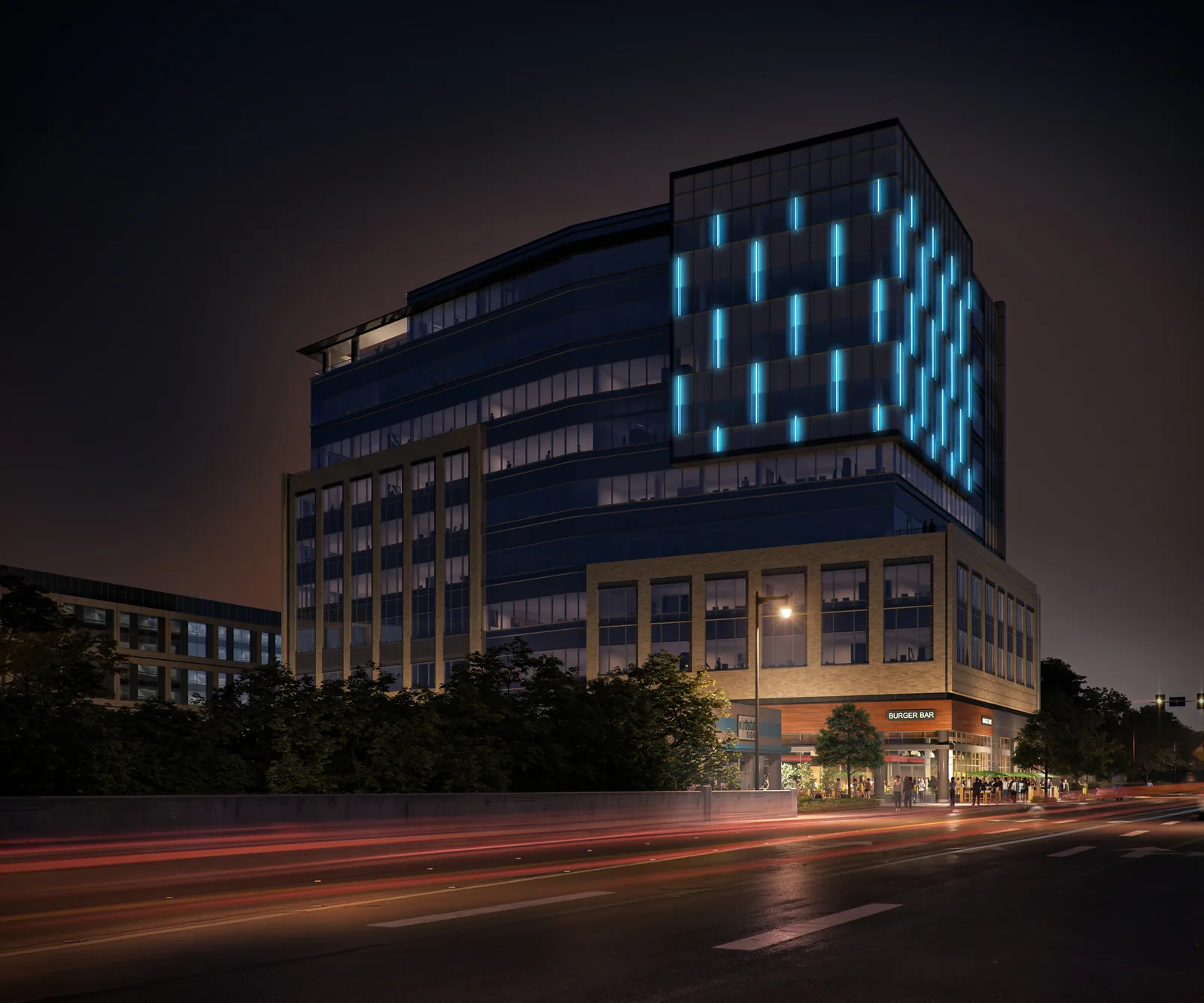 One Glenwood office building in downtown Raleigh at night with blue light patterns on its corner