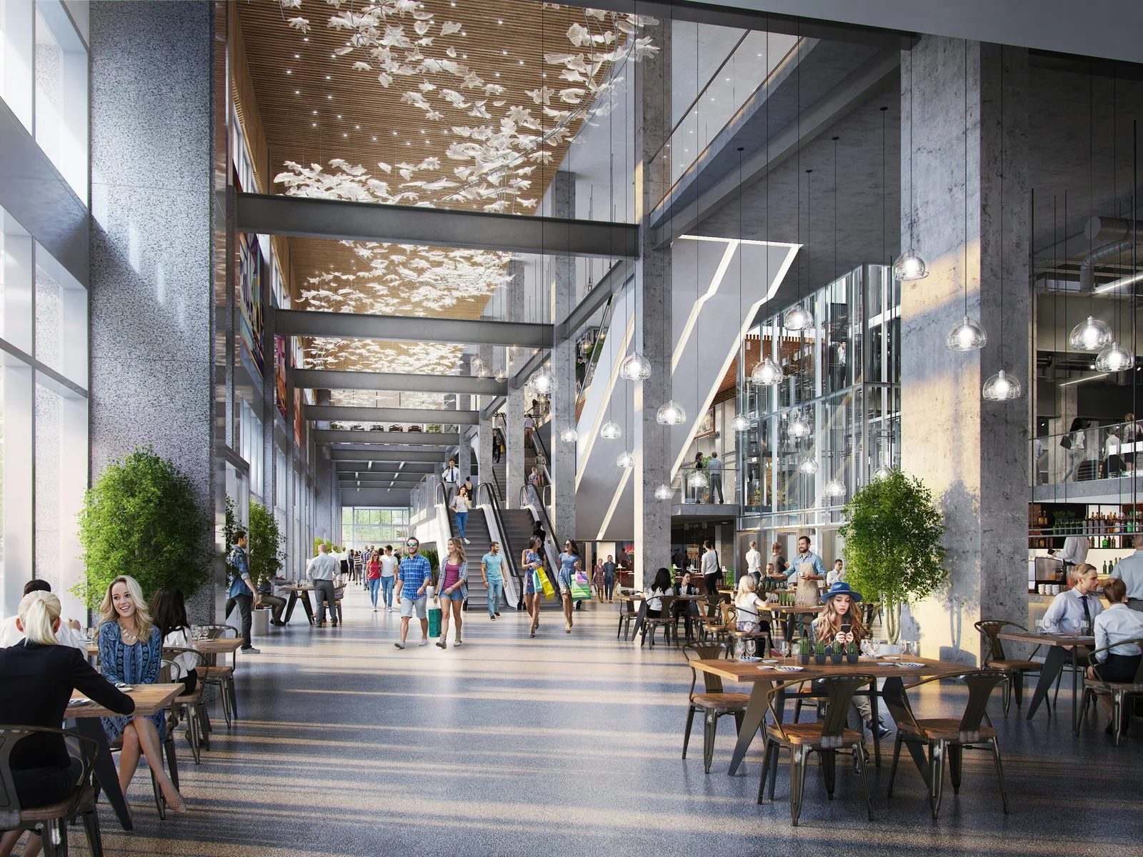 Double-height retail concourse with cafes and suspended light art at The Post, Vancouver