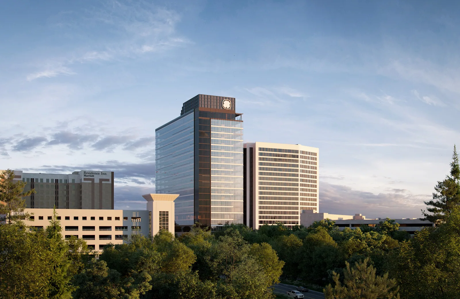 Salisbury Square office tower in the downtown Raleigh skyline seen across the trees