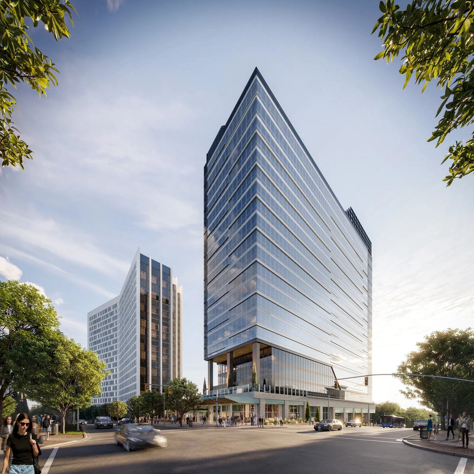 Angled glass office tower at Salisbury Square in downtown Raleigh, seen from the street corner