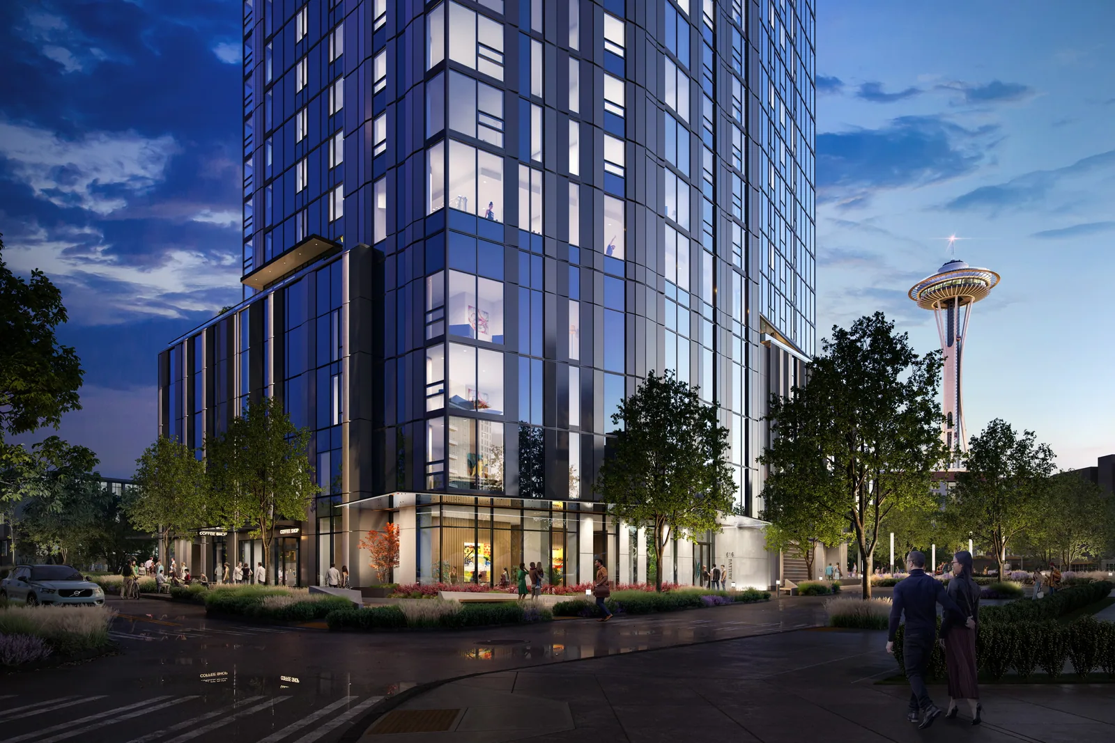 Sloane residential tower at 616 Battery Street in Seattle at dusk with the Space Needle beyond