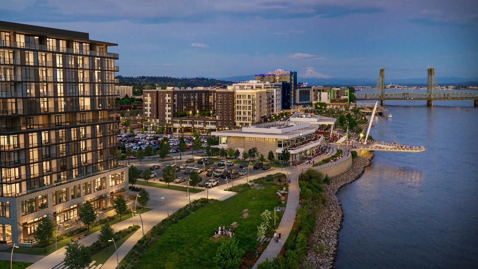 Senior living building along the Columbia River waterfront in Vancouver, Washington, at dusk