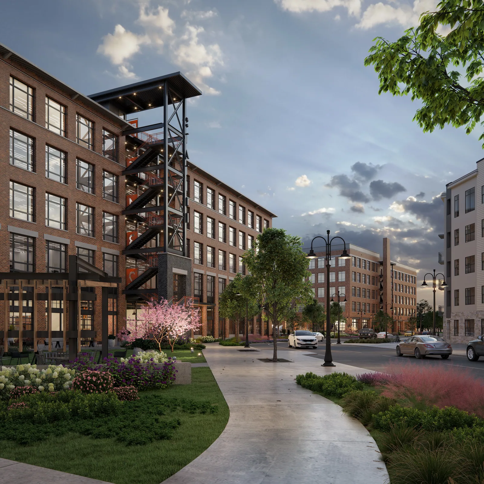 Landscaped walk between brick office buildings at The Station at LoSo in Charlotte