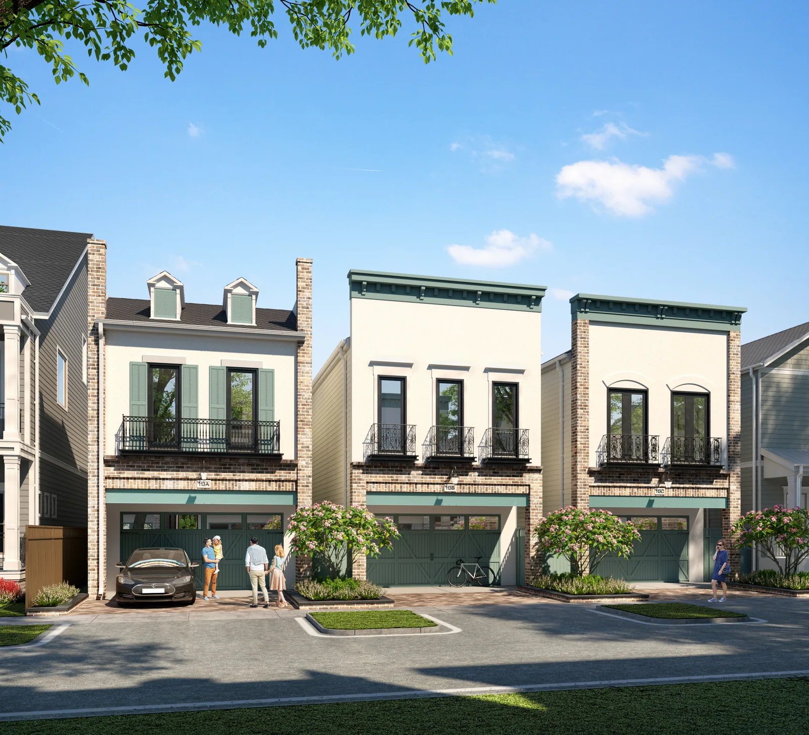 Brick and stucco homes with iron balconies and garages at Sunset Heights in Houston