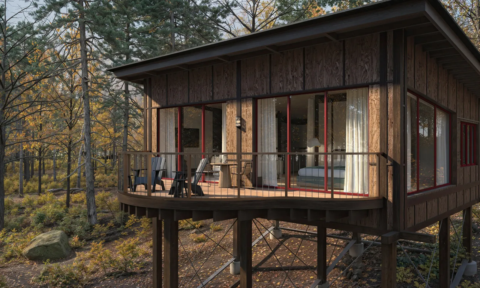 Timber treehouse on posts with a porch among trees at Twin Farms in Barnard, Vermont