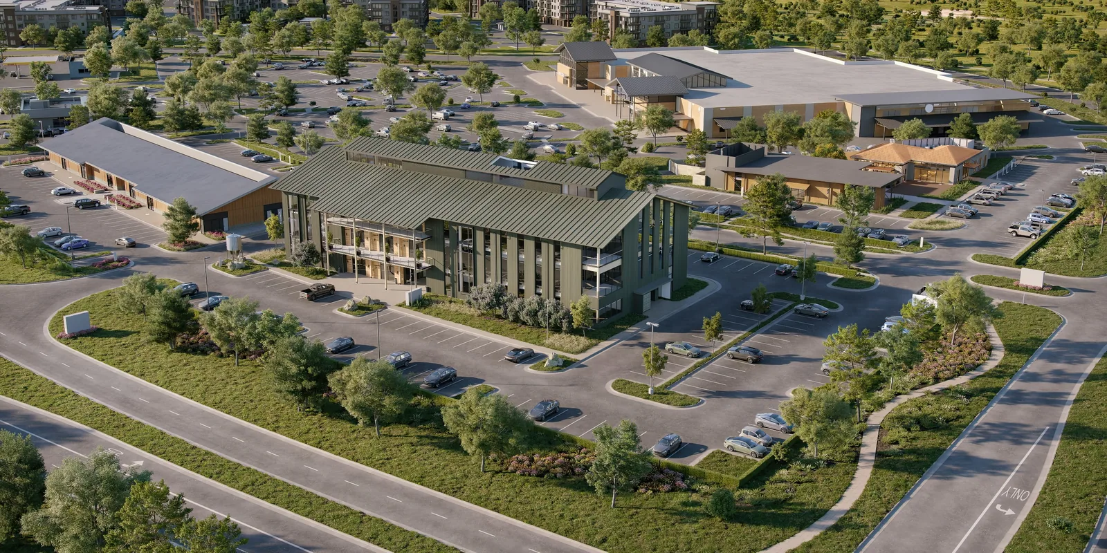 Aerial of a two-story building with a green standing-seam roof at Village Green at Bridgeland Central, Cypress, Texas