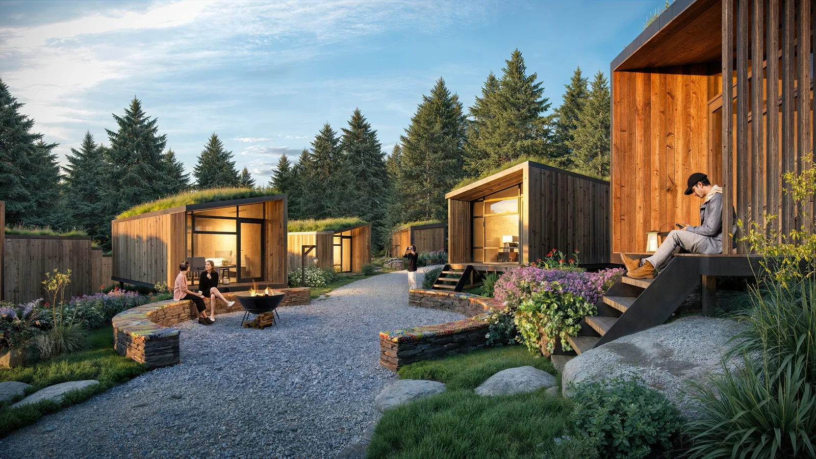 Small timber cabins with green roofs around a fire-pit court on Whidbey Island, Washington