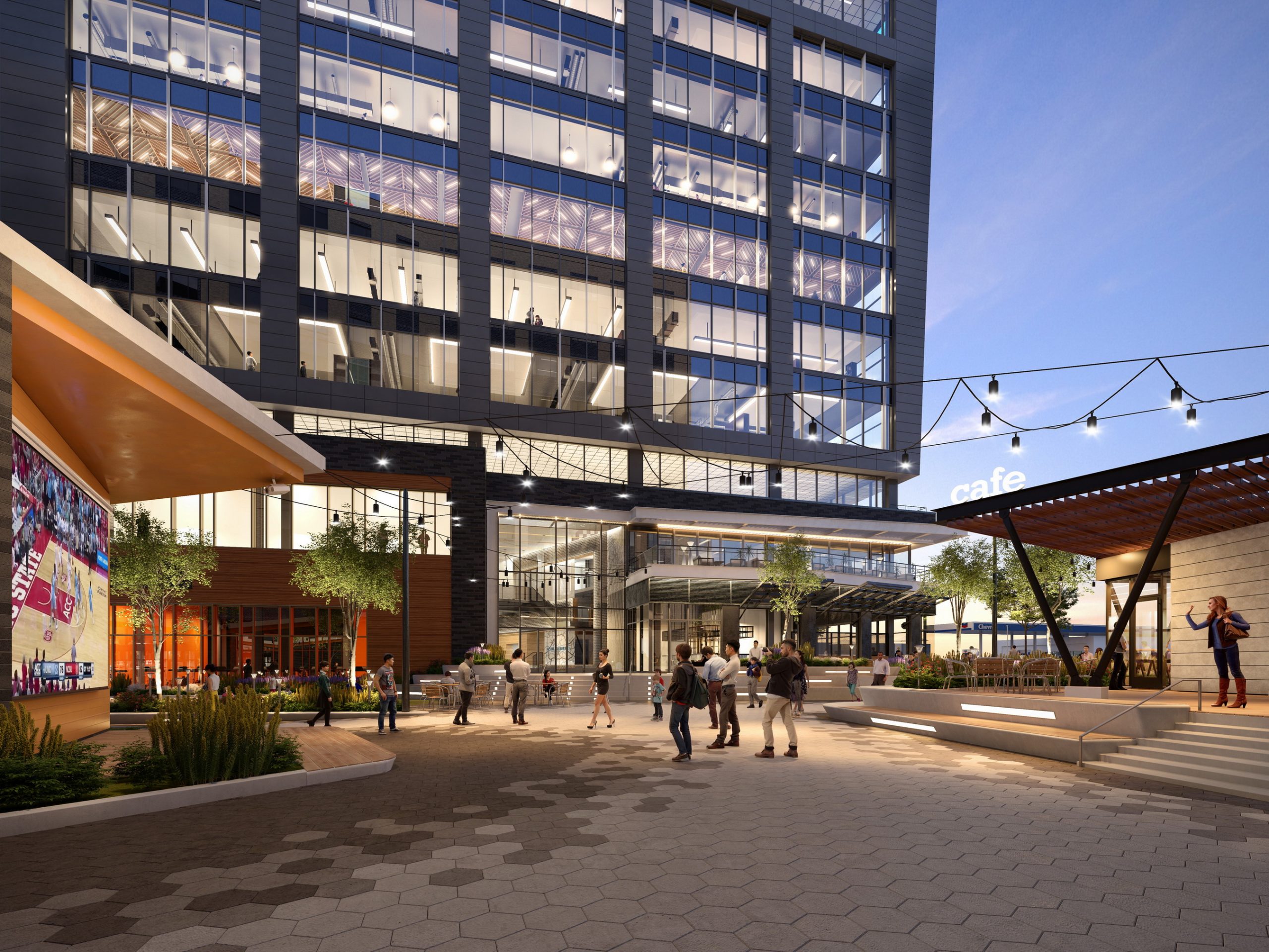 Tower Two at Bloc 83 Raleigh outdoor entertainment courtyard rendering by Bogza.com. A vibrant twilight view of the commercial plaza, showcasing a crowd gathered to watch a basketball game on a large outdoor screen, surrounded by illuminated retail storefronts and the glass office tower.