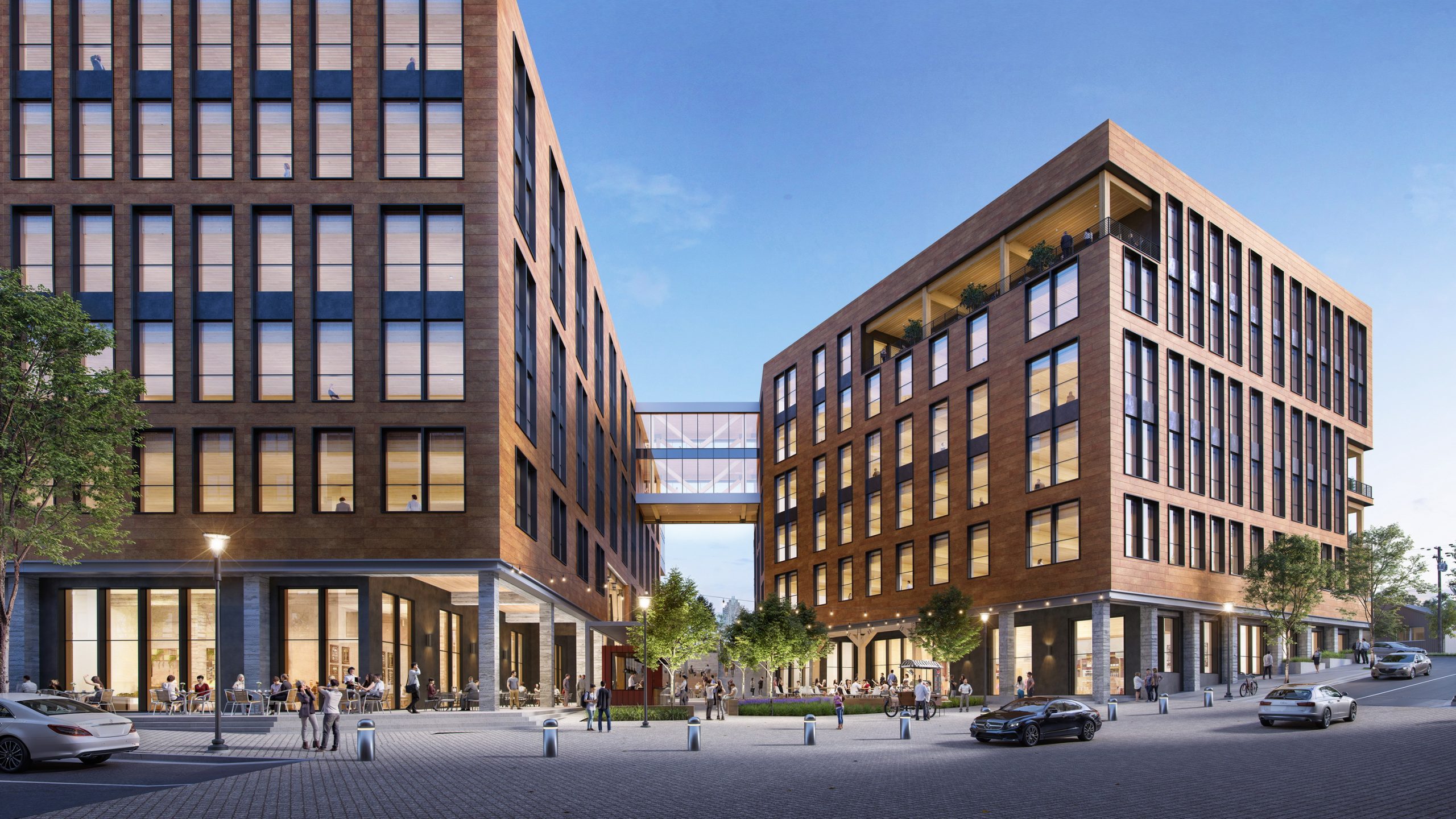 West End Raleigh commercial office skybridge exterior rendering by Bogza.com. A striking daytime pedestrian-level view of the new development on the former Clancy & Theys headquarters site, highlighting the dynamic glass skybridge linking two warm wood-toned buildings, above a bustling central courtyard with outdoor cafe seating.
