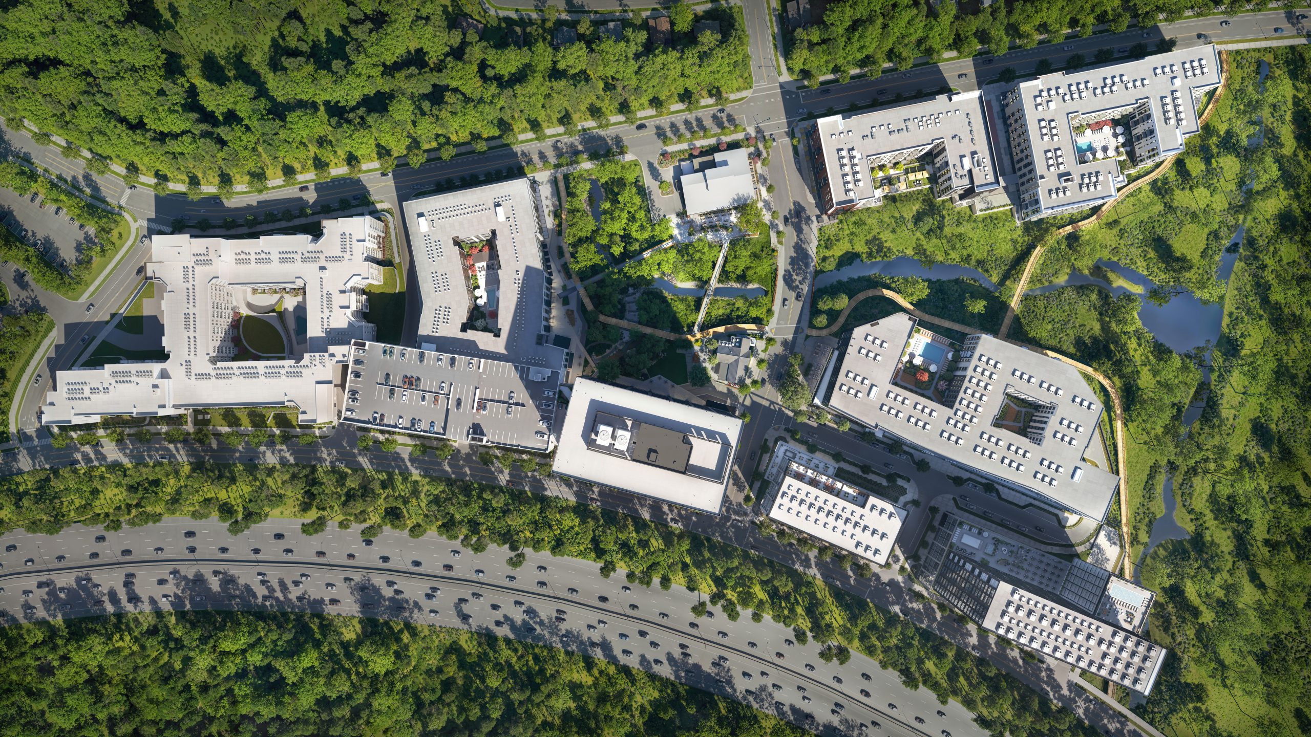 North Hills Innovation District NHID Raleigh aerial site plan rendering by Bogza.com. A high-angle bird's-eye drone view of the 33-acre mixed-use development, showcasing the layout of mid-rise apartments, the office tower, parking structures, the winding creek, pedestrian bridges, and the adjacent I-440 Beltline.