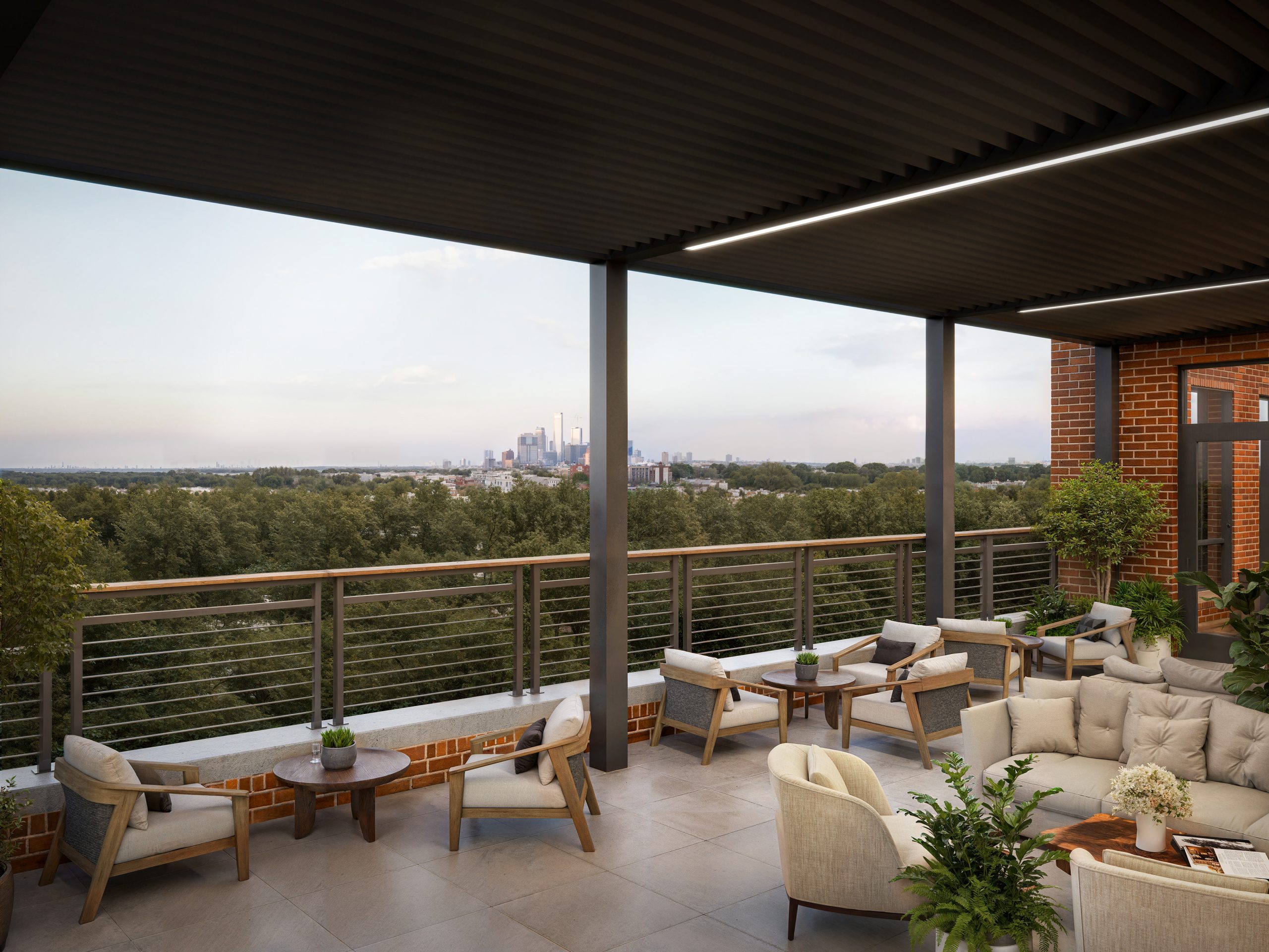 The Station at LoSo Charlotte rooftop terrace exterior rendering by Bogza.com. A twilight view of a luxurious covered outdoor office balcony, showcasing modern outdoor lounge furniture, a dark metal pergola canopy, string lights, and expansive views over the surrounding tree canopy.