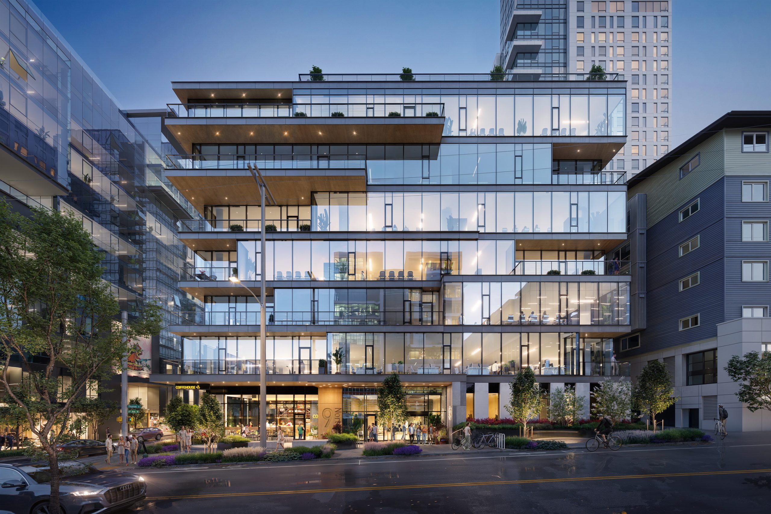 9 North Office Seattle street-level architectural rendering by Bogza.com. A dusk view of the modern 7-story glass commercial building showcasing warm illuminated interiors, active ground-floor retail, pedestrians, and a sleek modern facade.