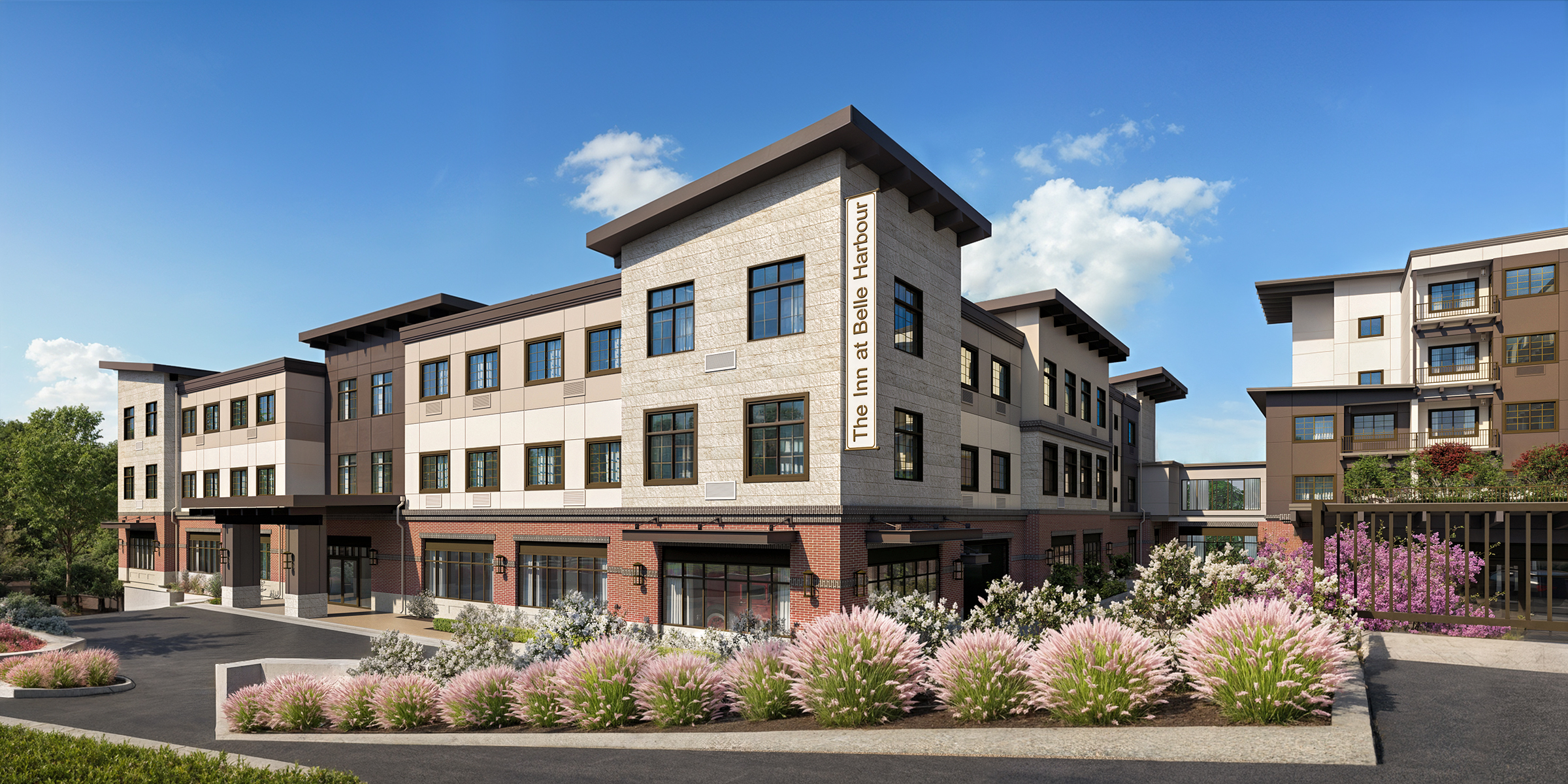 Bellevue Senior Living The Inn at Belle Harbour exterior architectural rendering by Bogza.com. A daytime view of the luxury memory care community in Bellevue, showcasing a modern classic facade, brick base, and lush native landscaping along the entrance driveway.