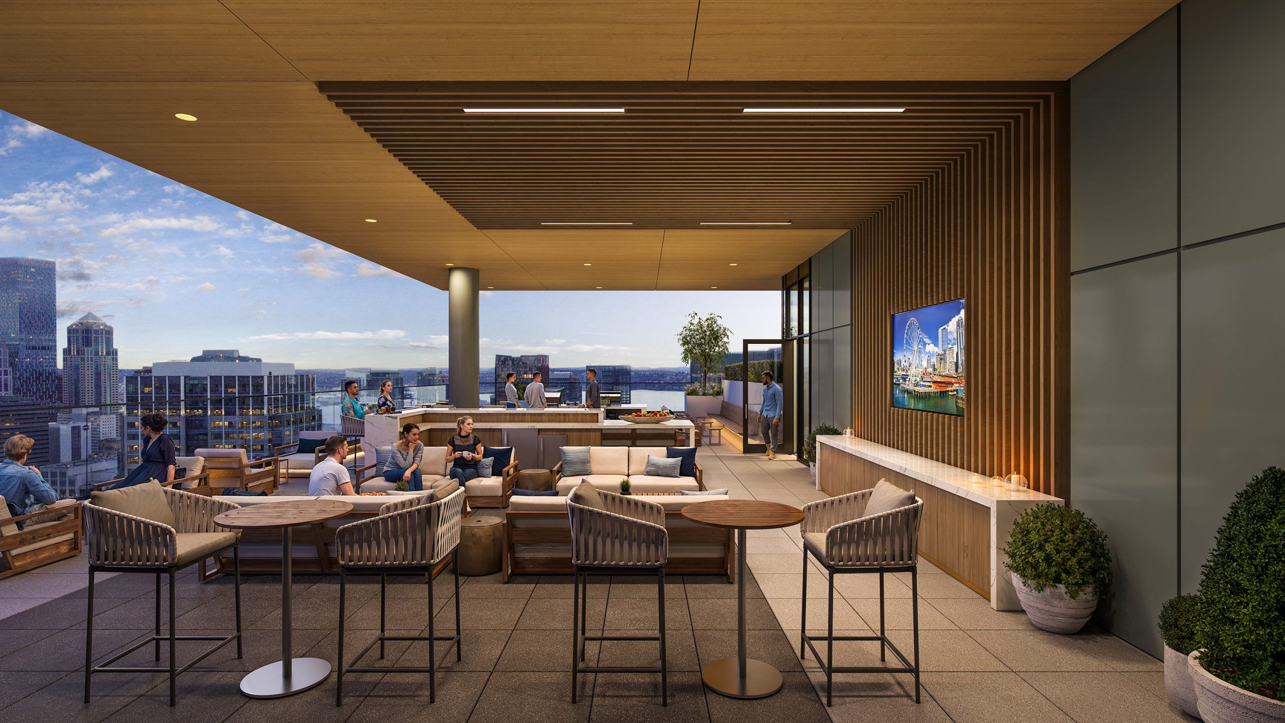 Boren Tower Seattle outdoor lounge and bar architectural rendering by Bogza.com. A twilight view of the apartment building's covered podium amenity space, featuring a long marble bar, comfortable lounge seating, a flat-screen TV, and sweeping views of the downtown skyline.