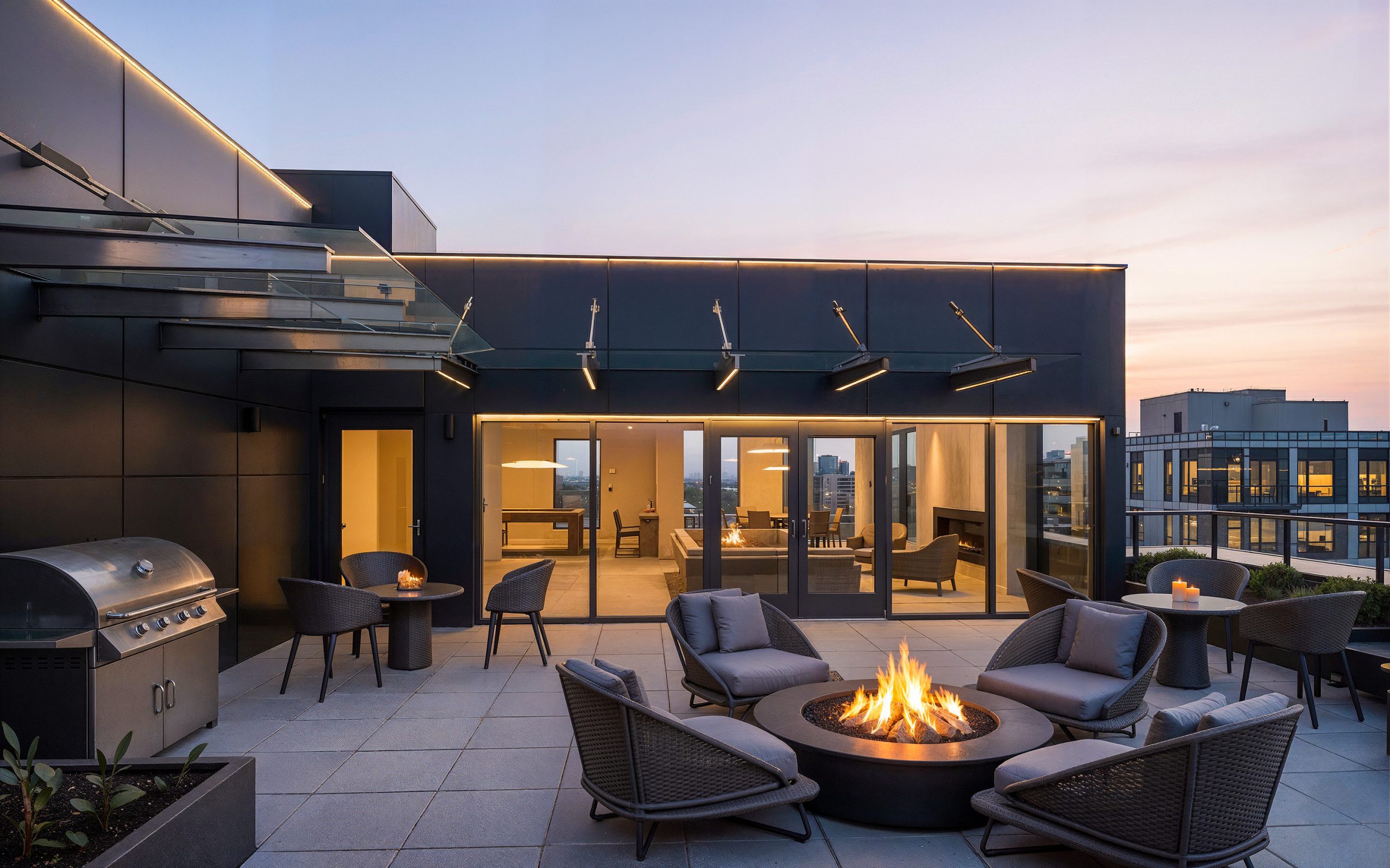 Hyde Square Bellevue rooftop lounge exterior architectural rendering by Bogza.com. A stunning twilight view of the luxury apartment community's sky deck, featuring a round fire pit surrounded by wicker chairs, a BBQ grill, an indoor clubhouse, and expansive views.